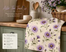Cream tea towel with a purple Aster floral design hanging in a kitchen.